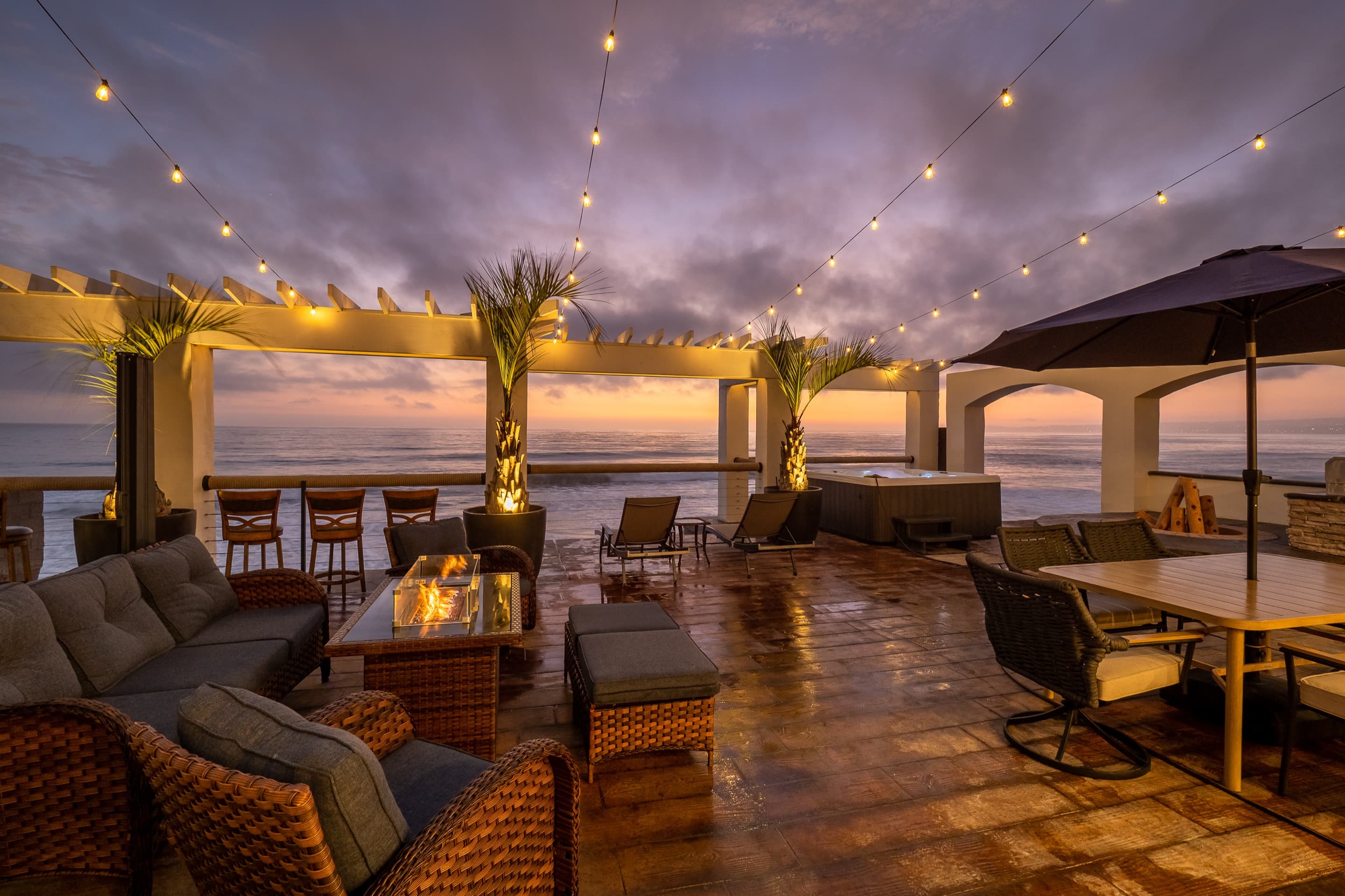 Sunset Retreat — oceanfront deck and pergola at sunset